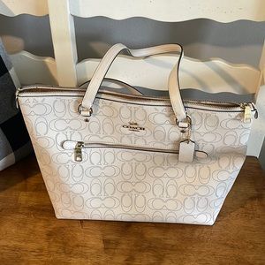 Used white signature coach purse